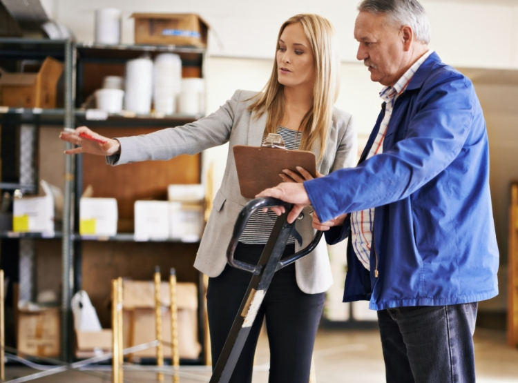 HR professional assisting in a warehouse